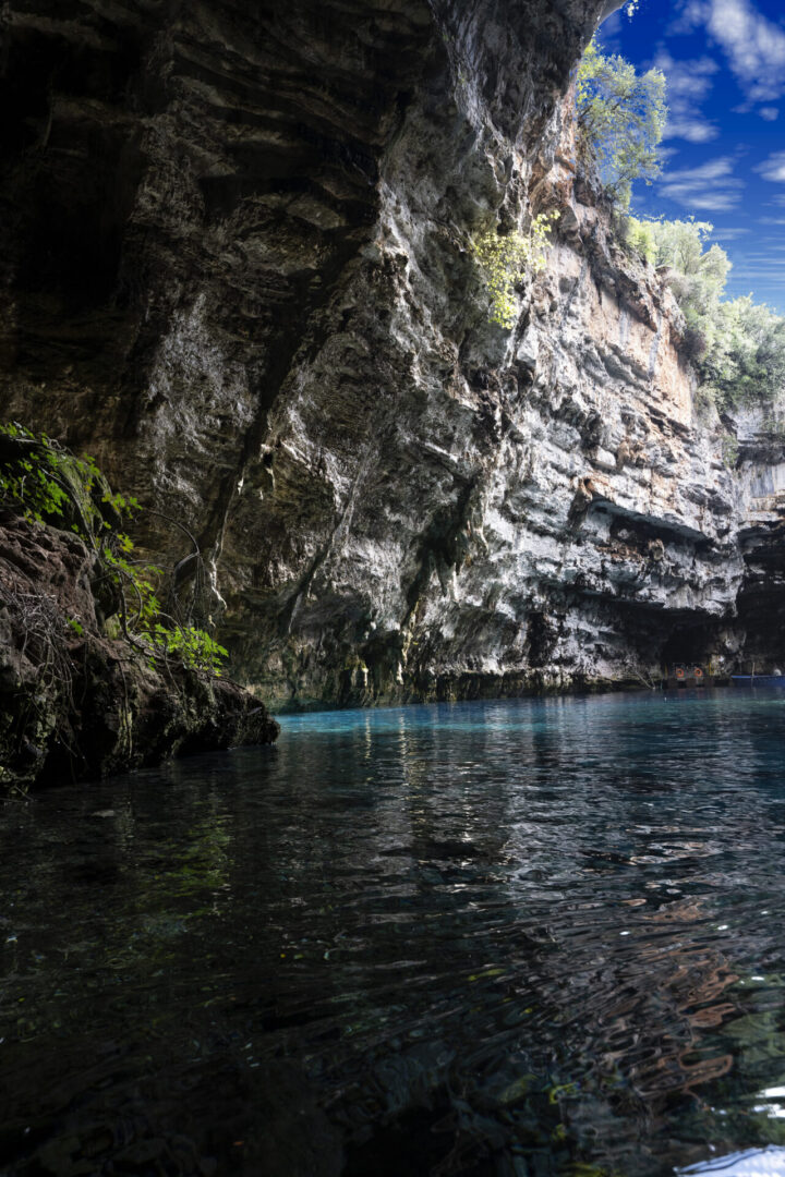 Rocky cave with clear turquoise water